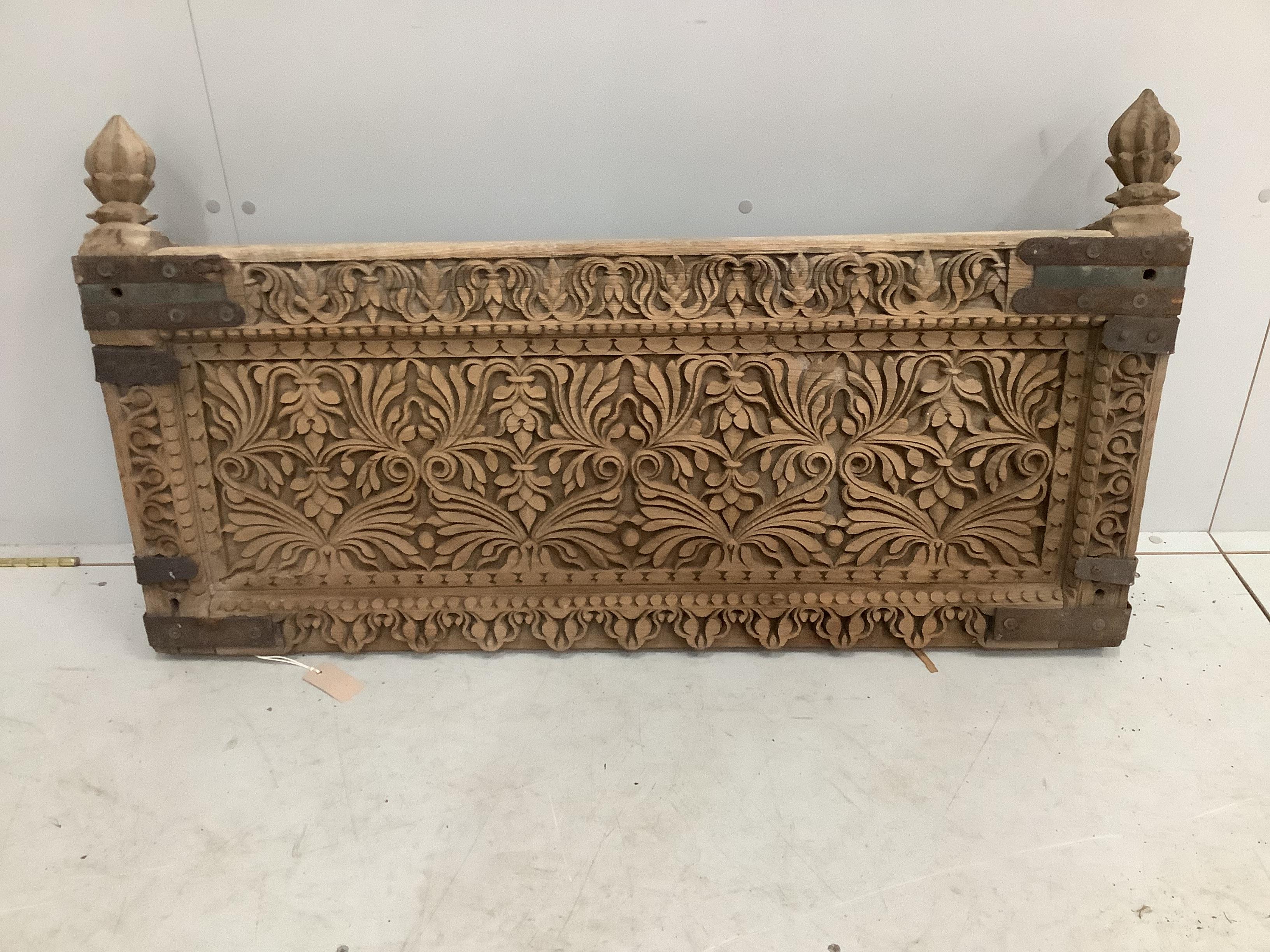 An Indian carved hardwood panel (probably a bench or bed section), width 112cm, height 61cm